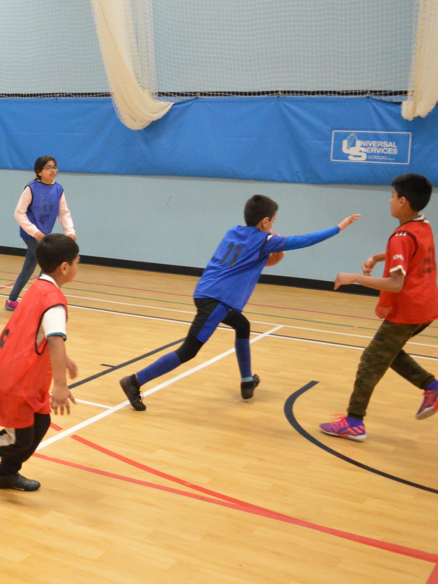 Boy running playing rugby