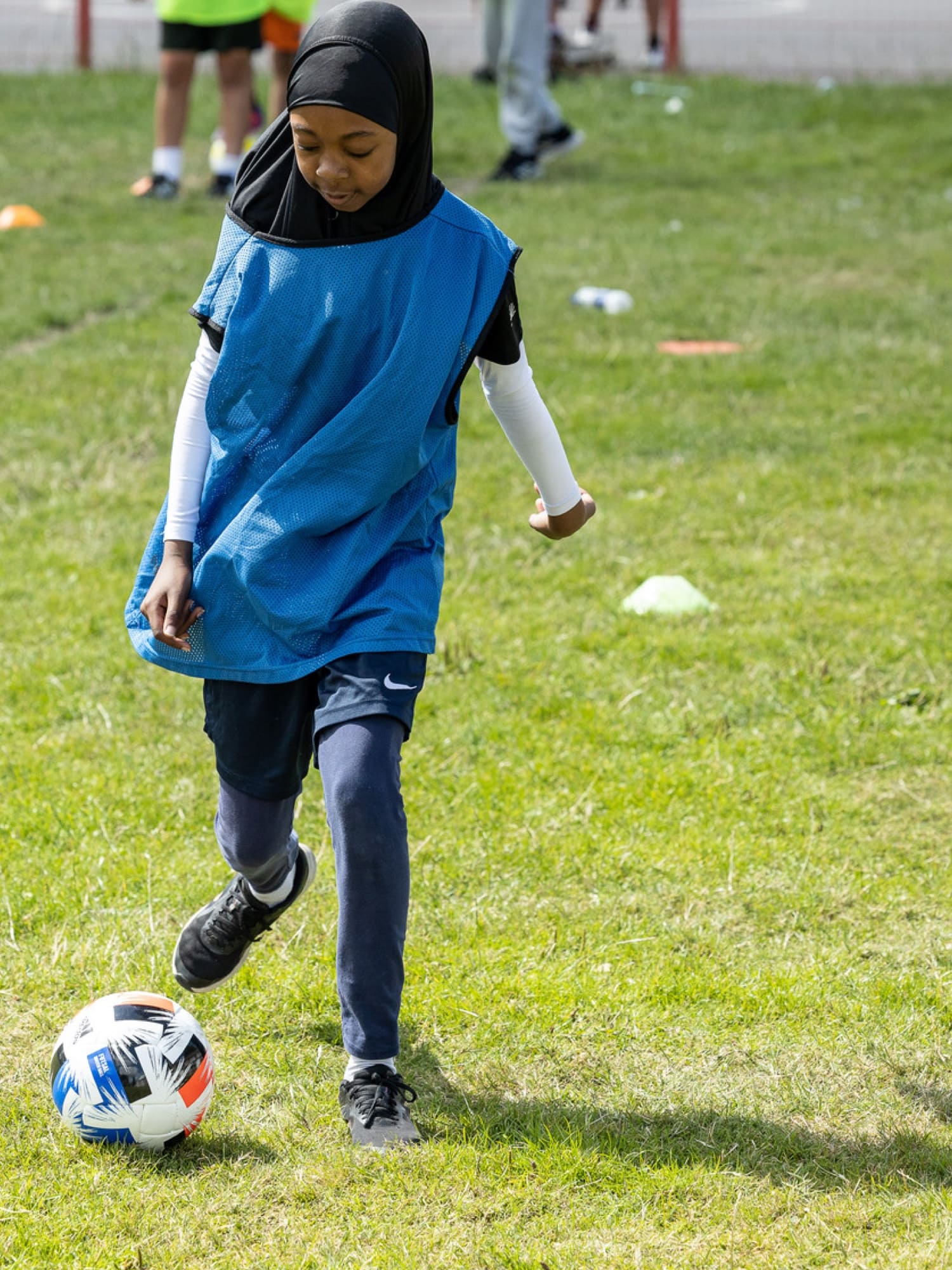 Girl playing football