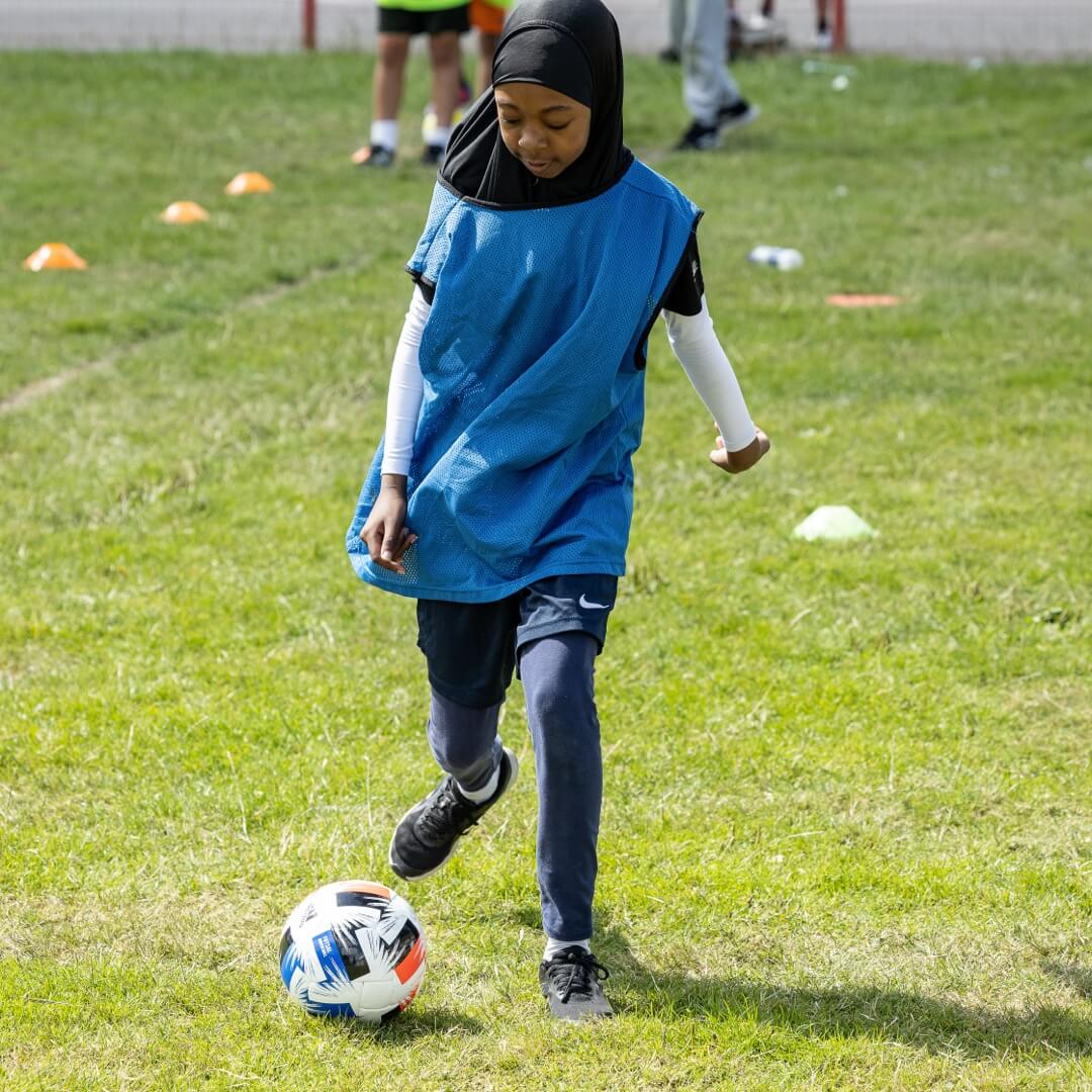 Girl playing football