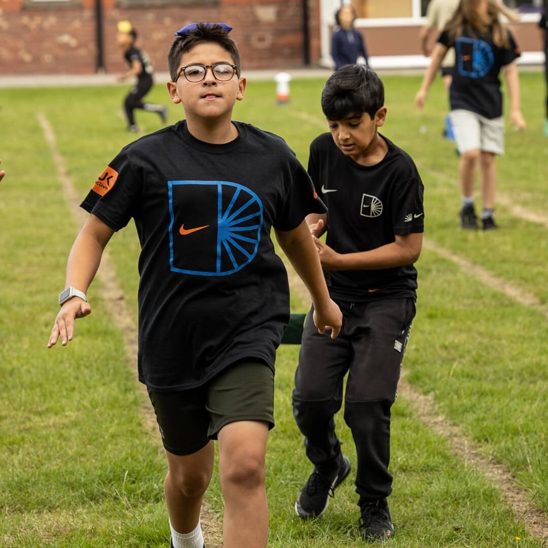 Students running on Athletics track