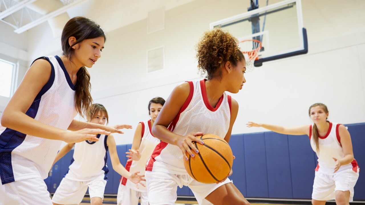 Pupils playing in a basketball league